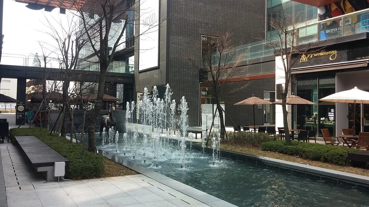 A fountain and pedestrian area at Songdo Canal Walk in Incheon.