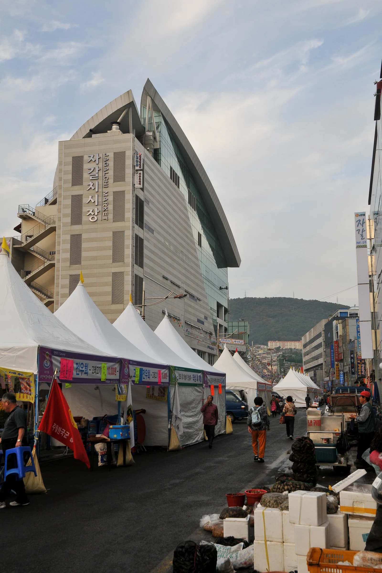 An outdoor market lane beside Jagalchi Market in Busan