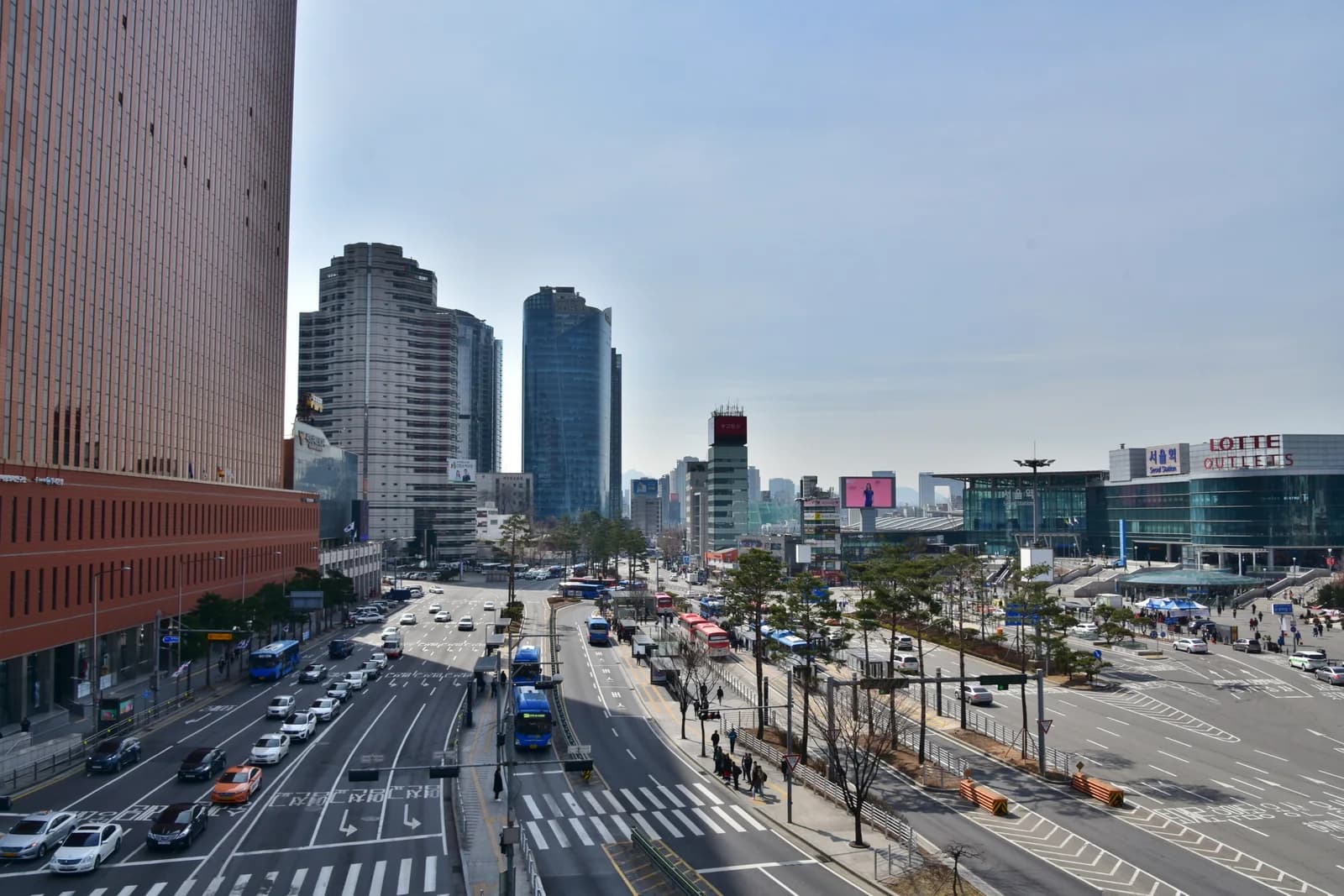 Seoul Square’s orange façade at left, opposite Seoul Station