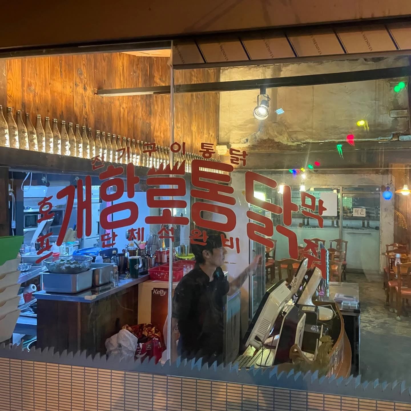 Gaehangro Chicken’s signed window and interior in Incheon, photographed in 2025.