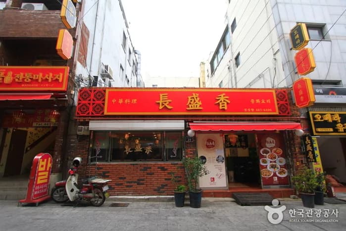 The red-and-gold Jangseonghyang storefront in Choryang Chinatown
